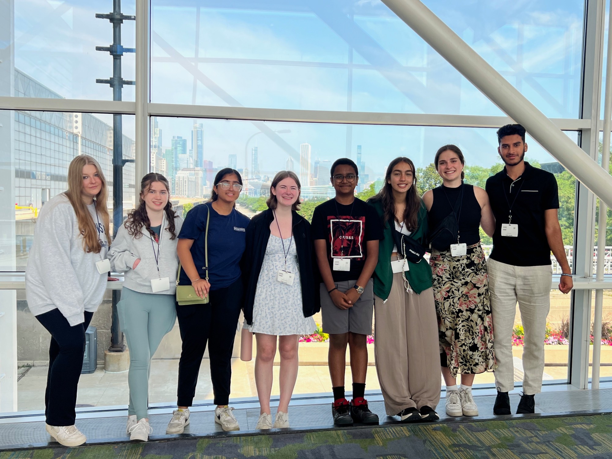 All eight Scholars with the Chicago skyline in the background